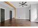 This bedroom features a ceiling fan, wood floors, and an attractive wood support beam at 908 N Highland Ne Ave, Atlanta, GA 30306