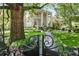Charming home featuring manicured landscaping and a gated entrance at 908 N Highland Ne Ave, Atlanta, GA 30306