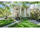 Stately home featuring elegant columns and a beautifully landscaped front yard at 908 N Highland Ne Ave, Atlanta, GA 30306