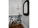 Elegant hallway with ornamental iron railing and decorative chandelier at 908 N Highland Ne Ave, Atlanta, GA 30306