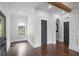 Hallway with hardwood floors, detailed trim, and natural light at 908 N Highland Ne Ave, Atlanta, GA 30306
