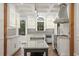 Bright and airy kitchen with stainless steel appliances, marble countertops and custom cabinets at 908 N Highland Ne Ave, Atlanta, GA 30306