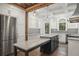 Spacious kitchen with a marble island, stainless steel appliances, and custom cabinetry at 908 N Highland Ne Ave, Atlanta, GA 30306