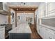 The bright kitchen boasts a large island, stainless appliances, and views into the living room at 908 N Highland Ne Ave, Atlanta, GA 30306