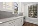 Beautiful kitchen with white cabinets, marble countertops, and stainless steel appliances at 908 N Highland Ne Ave, Atlanta, GA 30306