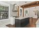 Lovely kitchen has marble countertops, wood beam ceiling, and stainless steel hood at 908 N Highland Ne Ave, Atlanta, GA 30306