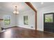 Living room with natural light, hardwood floors, and a decorative light fixture at 908 N Highland Ne Ave, Atlanta, GA 30306