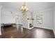 Bright living room with a stone fireplace and elegant chandelier at 908 N Highland Ne Ave, Atlanta, GA 30306