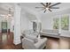 Bright living room with large windows, hardwood floors, and comfortable seating arrangement at 908 N Highland Ne Ave, Atlanta, GA 30306