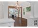Spacious living room with hardwood floors, large windows, and an open view into the modern kitchen at 908 N Highland Ne Ave, Atlanta, GA 30306