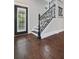 Elegant staircase featuring dark wood floors, decorative railings, and white trim at 908 N Highland Ne Ave, Atlanta, GA 30306