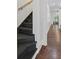 Staircase with wooden stairs and elegant trim, leading to the upper level at 908 N Highland Ne Ave, Atlanta, GA 30306