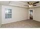 Bedroom with carpet, two windows for natural light, and doorway to bathroom at 137 Legend Creek Dr, Canton, GA 30114