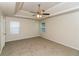 Spacious bedroom featuring a ceiling fan and two windows, offering a bright and airy atmosphere at 137 Legend Creek Dr, Canton, GA 30114