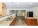 Open-concept kitchen features granite countertops, wood floors and access to the living room at 137 Legend Creek Dr, Canton, GA 30114