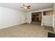 Bright and airy living room featuring neutral carpet, fireplace and open access to the kitchen at 137 Legend Creek Dr, Canton, GA 30114
