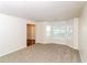 Bright living room with neutral carpet, natural light and a view of the front yard at 137 Legend Creek Dr, Canton, GA 30114