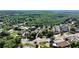Expansive aerial shot showcasing a residential area near a vibrant commercial district at 214 Vickery Falls Dr, Roswell, GA 30075