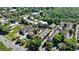 Aerial view capturing a residential neighborhood with a mix of housing styles, close to nature at 214 Vickery Falls Dr, Roswell, GA 30075