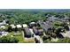 Aerial view of a community nestled in a lush, green landscape with diverse housing options at 214 Vickery Falls Dr, Roswell, GA 30075