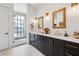 Bathroom with double vanity, tile floor, dark wood cabinets, and glass enclosed shower at 214 Vickery Falls Dr, Roswell, GA 30075