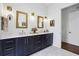Bathroom with double sink vanity with tile floors, dark wood cabinets, and decorative mirrors at 214 Vickery Falls Dr, Roswell, GA 30075