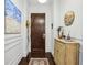 Stylish entryway showcasing hardwood floors, decorative art, and a solid wood door with modern hardware at 214 Vickery Falls Dr, Roswell, GA 30075