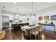 Bright eat-in kitchen features stainless steel appliances, dark wood floors, and large center island at 214 Vickery Falls Dr, Roswell, GA 30075