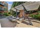 Outdoor living space with a fireplace, pergola, and dining and lounge furniture at 214 Vickery Falls Dr, Roswell, GA 30075