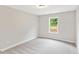 Neutral bedroom with a window offering natural light at 4655 Larkfield Way, Powder Springs, GA 30127