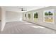 Large bedroom with multiple windows and neutral carpet at 4655 Larkfield Way, Powder Springs, GA 30127