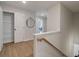 Hallway leading to multiple rooms, including a closet with shelving and a potential office space at 4655 Larkfield Way, Powder Springs, GA 30127