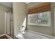 Bright bathroom with a soaking tub under a window and a separate glass shower at 5437 Blossom Brook Dr, Sugar Hill, GA 30518