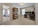 Versatile room with space for office, including views into the carpeted bedroom with ceiling fan at 5437 Blossom Brook Dr, Sugar Hill, GA 30518