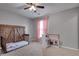 Charming bedroom with a rustic bed frame, pink curtains, and a play kitchen at 5437 Blossom Brook Dr, Sugar Hill, GA 30518