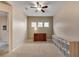 Versatile flex room with carpet, three windows, a ceiling fan, and lots of storage space at 5437 Blossom Brook Dr, Sugar Hill, GA 30518