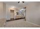 Open concept living room with hardwood floors, lots of natural light, and convenient access to other areas at 5437 Blossom Brook Dr, Sugar Hill, GA 30518