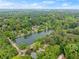 Picturesque aerial view of a lake community with homes nestled among the trees, offering a peaceful retreat at 1190 Hess Dr, Avondale Estates, GA 30002