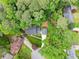 Stunning aerial view of a home nestled among lush greenery and mature trees in a quiet neighborhood at 1190 Hess Dr, Avondale Estates, GA 30002