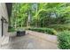Back patio area with barbecue and brick wall. A great outdoor area for entertaining at 1190 Hess Dr, Avondale Estates, GA 30002