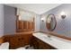 Charming bathroom featuring a quartz countertop and floral wallpaper at 1190 Hess Dr, Avondale Estates, GA 30002