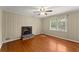 Bedroom featuring hardwood floors, fireplace and natural light at 1190 Hess Dr, Avondale Estates, GA 30002