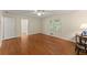 Bright bedroom featuring hardwood floors, two windows with a doorway leading to a bathroom at 1190 Hess Dr, Avondale Estates, GA 30002
