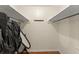 Walk-in closet with hanging rods, shelving, and a full-length mirror at 1190 Hess Dr, Avondale Estates, GA 30002
