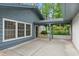 Charming home exterior with blue siding, white trim windows, and covered patio perfect for outdoor enjoyment at 1190 Hess Dr, Avondale Estates, GA 30002