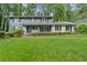 Traditional two-story home with shutters and a lush green lawn at 1190 Hess Dr, Avondale Estates, GA 30002