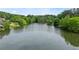 Scenic lake view with lush green trees creating a peaceful and serene atmosphere, perfect for nature lovers at 1190 Hess Dr, Avondale Estates, GA 30002