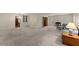 Large living room with fireplace, carpet, and doorways to other rooms and built-in cabinets at 1190 Hess Dr, Avondale Estates, GA 30002