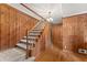 Classic staircase with wood paneling and plush carpeting at 1190 Hess Dr, Avondale Estates, GA 30002
