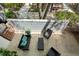 Aerial view of back patio with outdoor seating surrounded by lush greenery and a patterned privacy fence at 195 Arizona Ne Ave # 104, Atlanta, GA 30307